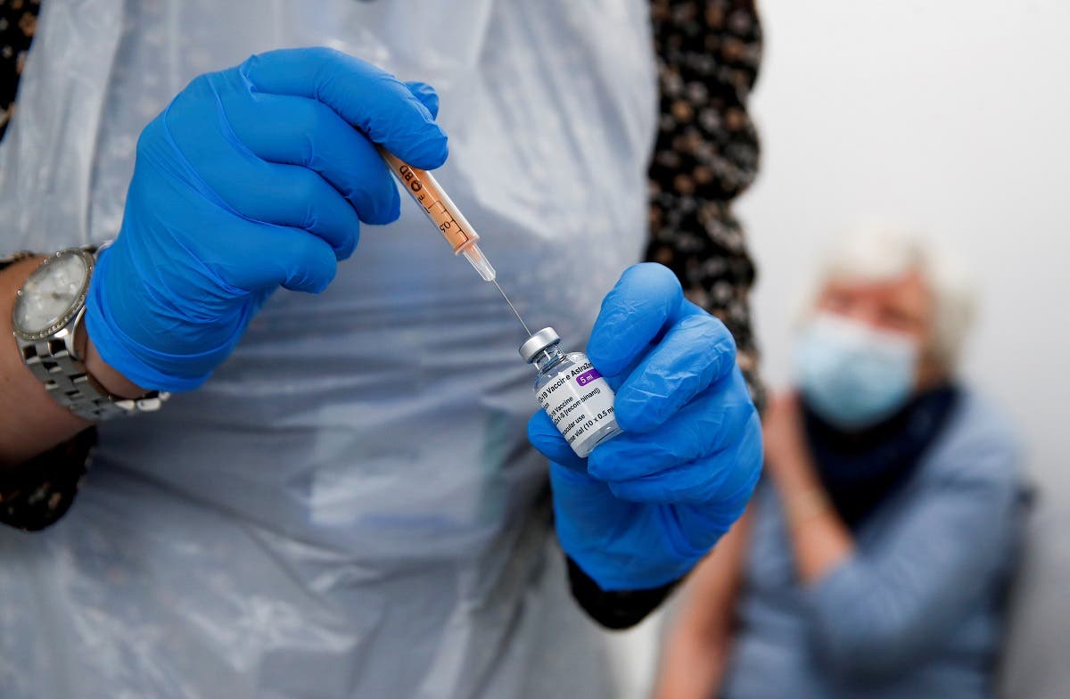 A health worker fills a syringe with a dose of the Oxford/AstraZeneca COVID-19 vaccine. (Reuters)