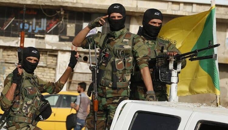 عناصر من ميليشيا حزب الله العراقية الموالية لإيران (فرانس برس)