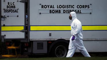 A police forensic officer walks past a bomb disposal unit van outside the Wockhardt pharmaceutical plant in Wrexham, Britain January 27, 2021. (Reuters)
