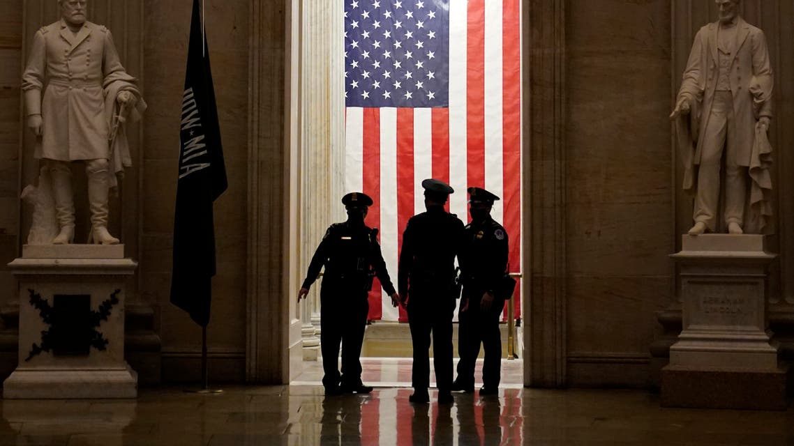 Capitol Police officers talk in the Capitol Rotunda on Capitol Hill in Washington, Monday evening, Jan. 25, 2021. (AP Photo/Susan Walsh)