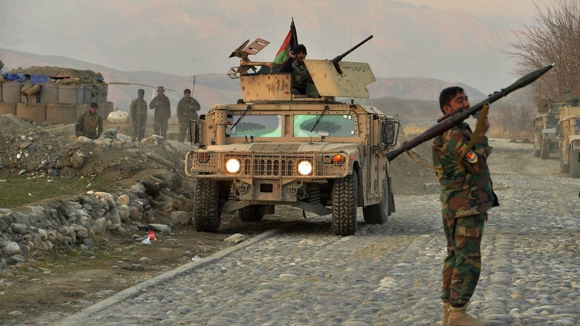 An Afghan security force personnel holds a rocket-propelled grenade (RPG) near the site of a car bomb attack in Sherzad district of Nangarhar Province on January 30, 2021. (Noorullah Shirzada/AFP)