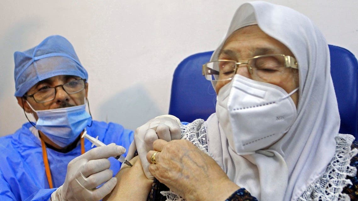 A woman receives the Sputnik-V COVID-19 vaccine at a vaccination center in Blida, south of Algiers, Algeria, Saturday, Jan. 30, 2021. (AP/Fateh Guidoum)