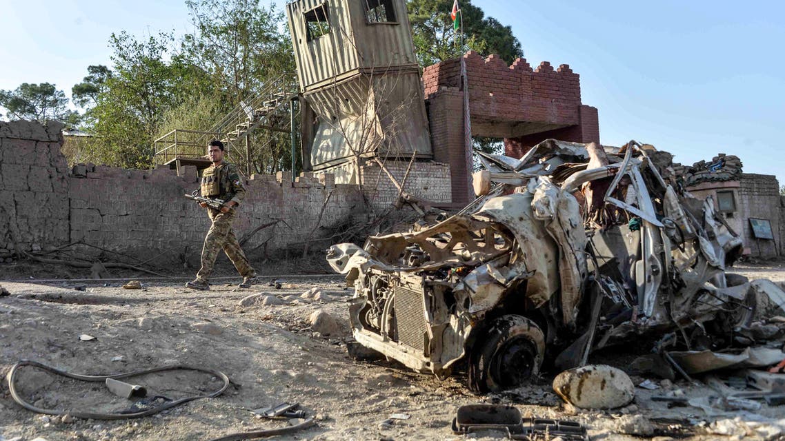Security personnel inspect the site of a car bomb attack that targeted a government building in Ghani Khel district of Nangarhar province on October 3, 2020. At least 15 people were killed and more than 30 others wounded in a car bomb attack that targeted a government building in eastern Afghanistan on October 3, officials said.