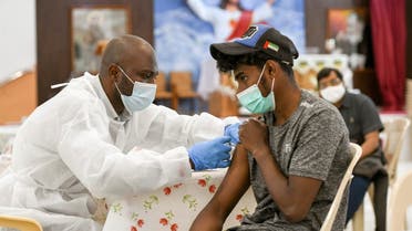 A man receives a dose of a vaccine against the coronavirus disease (COVID-19)at St. Paul's Church in Abu Dhabi. (Reuters)