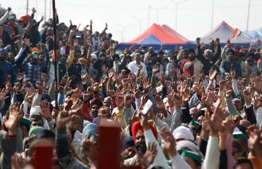 Farmers raise their hand as they shout slogans during a day-long hunger strike to protest against new farm laws, at the Delhi-Uttar Pradesh border, on the outskirts of New Delhi, India on Jan. 30, 2021. (AP)