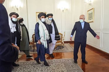 A picture obtained by AFP from the Iranian news agency Tasnim on January 31, 2021, shows Zarif (R) meeting with Mullah Abdul Ghani Baradar (C-L) of the Taliban in Tehran. (AFP)