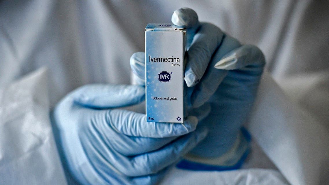 A health worker shows a box containing a bottle of Ivermectin, a medicine authorized by the National Institute for Food and Drug Surveillance to treat patients with mild, asymptomatic or suspicious COVID-19, as part of a study of the Center for Paediatric Infectious Diseases Studies, in Cali, Colombia, on July 21, 2020. (Luis Robayo/AFP)