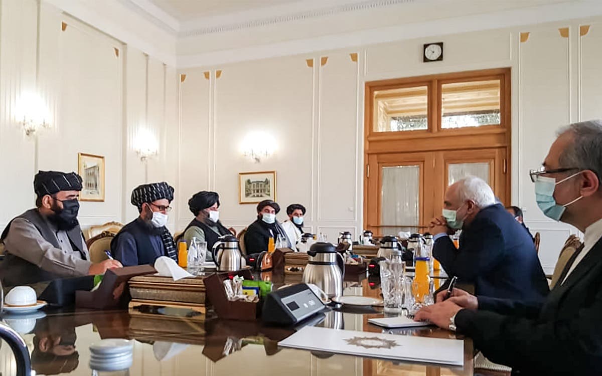 A picture obtained by AFP from the Iranian news agency Tasnim on January 31, 2021, shows  Iran’ FM Mohammad Javad Zarif (2nd-R) meeting with Mullah Abdul Ghani Baradar (2nd-L) of the Taliban in Tehran. (AFP)