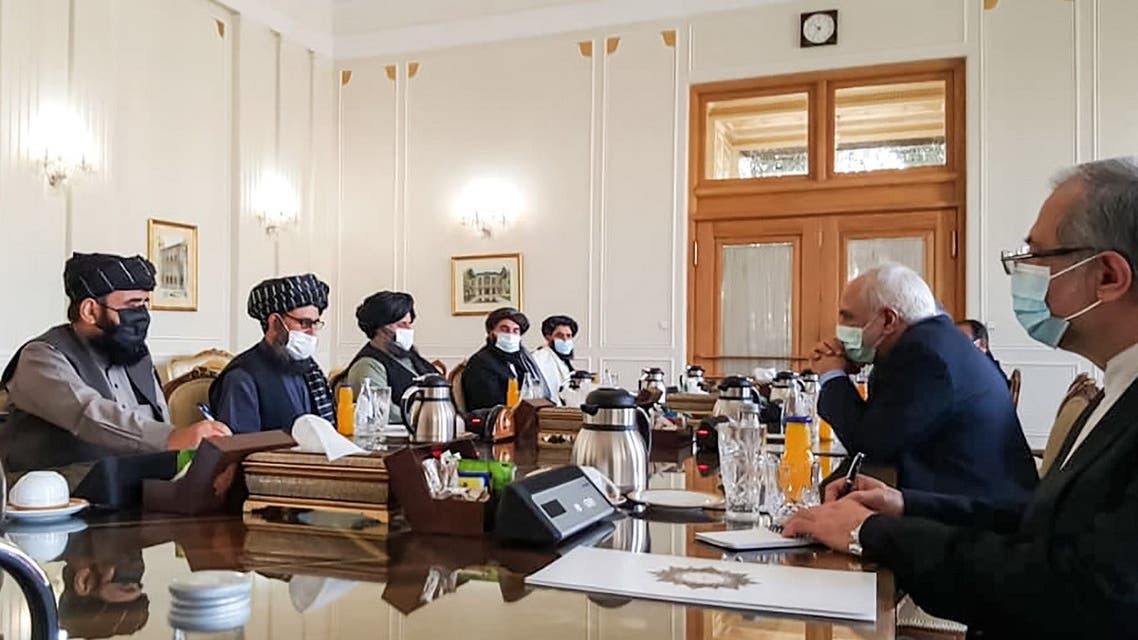 A picture obtained by AFP from the Iranian news agency Tasnim on January 31, 2021, shows Iran’ FM Mohammad Javad Zarif (2nd-R) meeting with Mullah Abdul Ghani Baradar (2nd-L) of the Taliban in Tehran. (AFP)