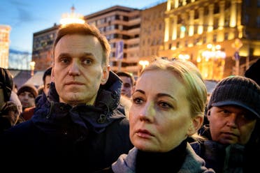Russian opposition leader Alexei Navalny (L) and his wife Yulia pay tribute with several thousand opposition supporters to the victims of a Siberian shopping mall fire at Pushkinskaya Square in downtown Moscow on March 27, 2018. (AFP)