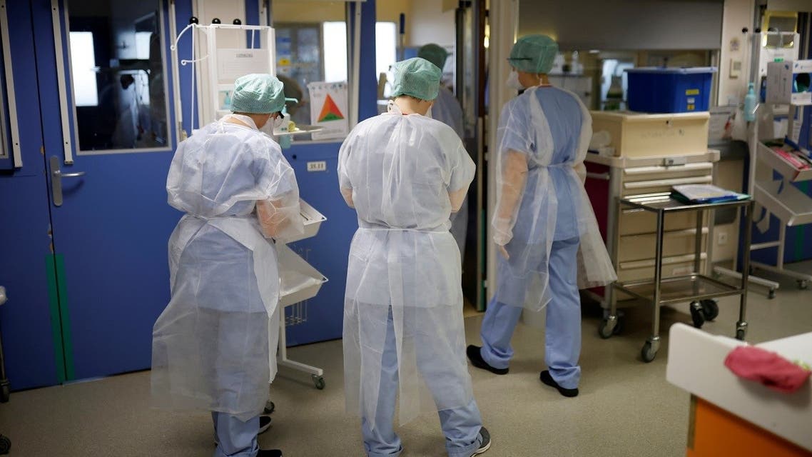Medical staff members work in the Intensive Care Unit (ICU) for COVID-19 patients at a hospital in Le Mans, France, January 18, 2021. (Reuters/Stephane Mahe)