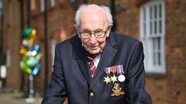  In this file photo taken on April 16, 2020 British World War II veteran Captain Tom Moore, 99, poses doing a lap of his garden in the village of Marston Moretaine, 50 miles north of London. (AFP)