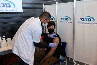 A teenager receives a vaccination against the coronavirus disease (COVID-19), in Tel Aviv, Israel, January 24, 2021. (Reuters)