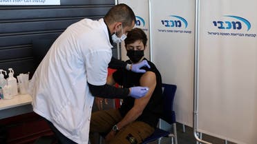 A teenager receives a vaccination against the coronavirus disease (COVID-19), in Tel Aviv, Israel, January 24, 2021. (Reuters/Ronen Zvulun)