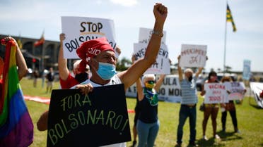 Demonstrators protest against Brazilian president Jair Bolsonaro and his management of the novel coronavirus disease, COVID-19, in Brasilia, on January 31, 2021. (AFP)