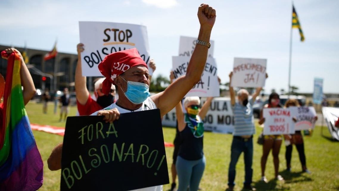 Demonstrators protest against Brazilian president Jair Bolsonaro and his management of the novel coronavirus disease, COVID-19, in Brasilia, on January 31, 2021. (AFP)