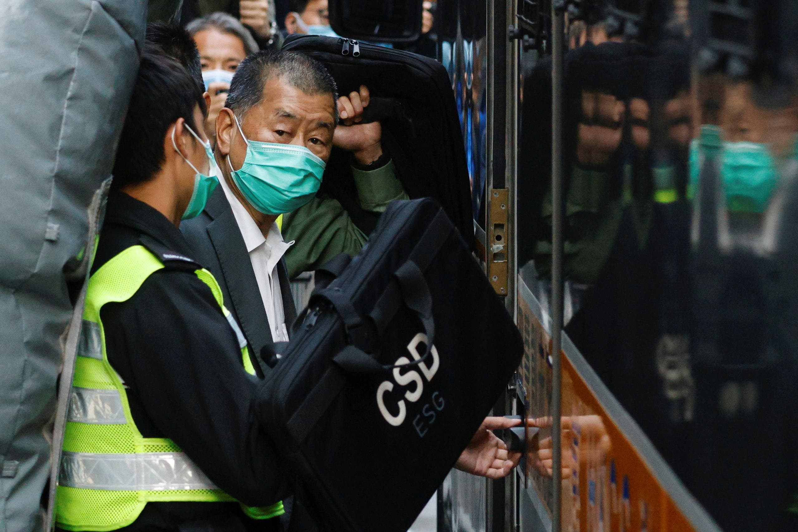 Media tycoon Jimmy Lai, founder of Apple Daily, looks on as he leaves the Court of Final Appeal by prison van, in Hong Kong, China February 1, 2021. (Reuters)