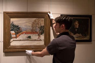 Another painting by Winston Churchill called ‘The Weald of Kent Under Snow’ at Sotheby’s auction house in London, England, Dec. 9, 2014. (AP/Tim Ireland)