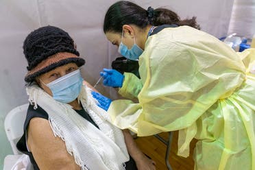Registered Nurse Rita Alba gives a patient the first dose of the coronavirus vaccine at a pop-up COVID-19 vaccination site in the Bronx, New York, United States, January 31, 2021. (AP)