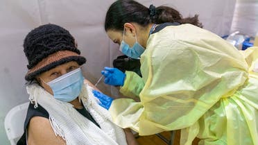Registered Nurse Rita Alba gives a patient the first dose of the coronavirus vaccine at a pop-up COVID-19 vaccination site in the Bronx, Jan. 31, 2021. (AP)