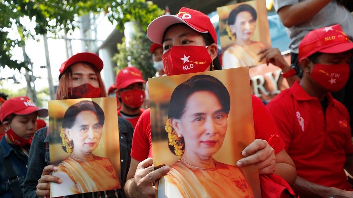 Burmese living in Thailand hold pictures of Myanmar leader Aung San Suu Kyi during a protest in front of the Myanmar Embassy in Bangkok, Feb. 1, 2021. (AP)