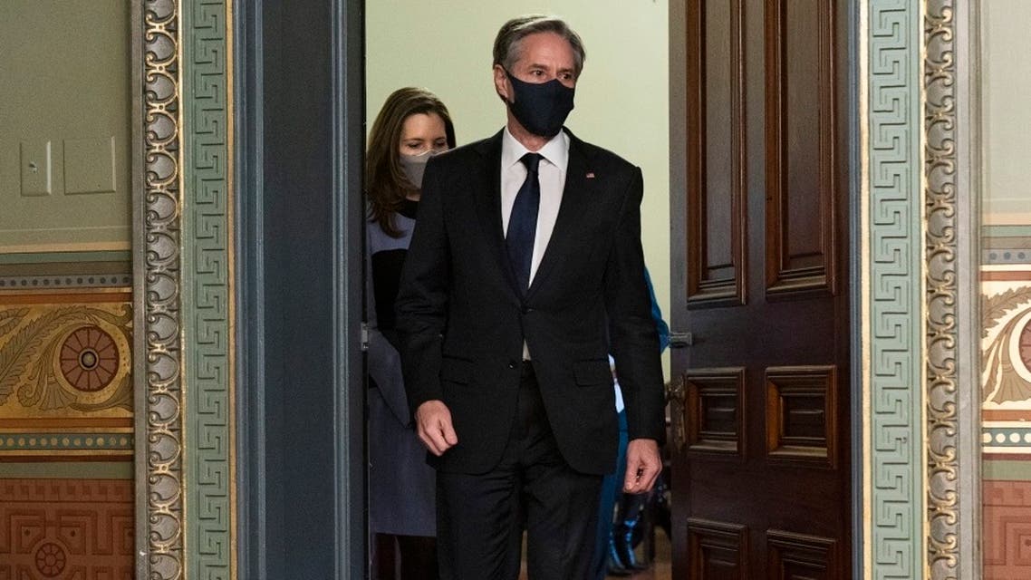 Antony Blinken, accompanied by his wife Evan Ryan, arrives for his ceremonial swearing-in as Secretary of State, Jan. 27, 2021. (AP)