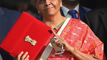 India's Finance Minister Nirmala Sitharaman gestures as she leaves the Finance Ministry to present the annual budget in parliament in New Delhi on February 1, 2021. (AFP)
