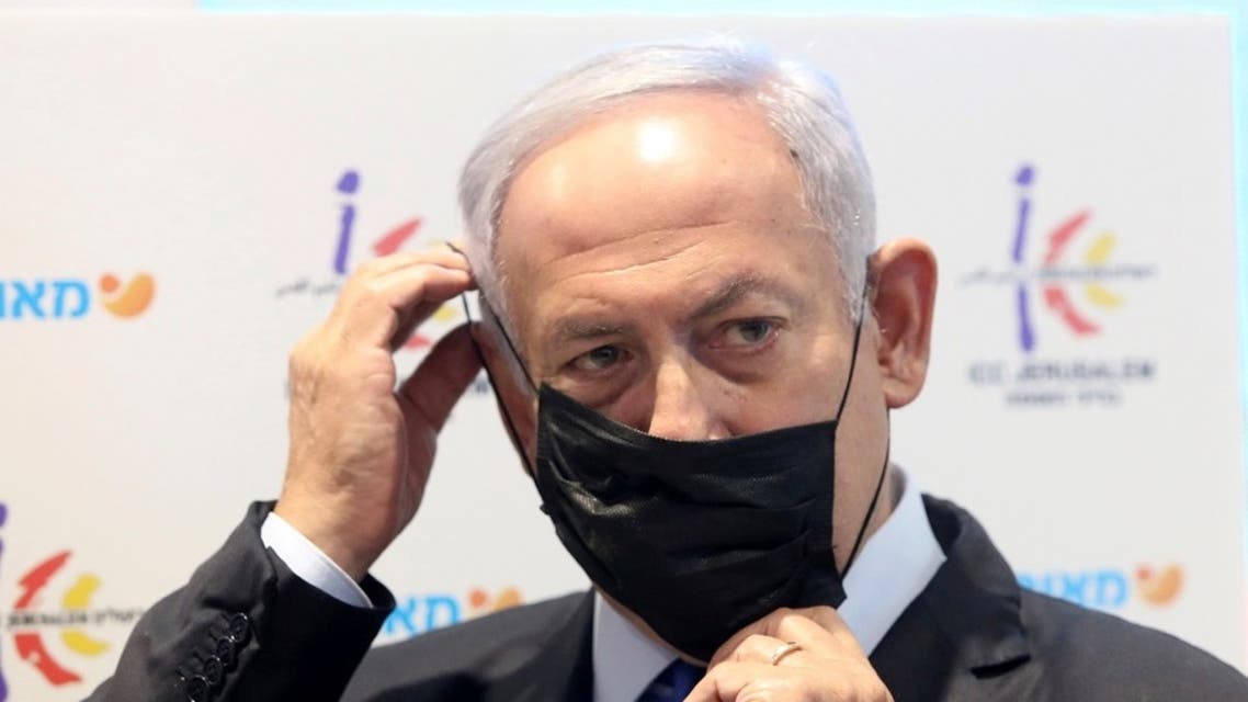 Israeli PM Benjamin Netanyahu speaks during a visit to a healthcare maintenance organization (HMO) center in Jerusalem, Jan. 6, 2021. (Reuters)