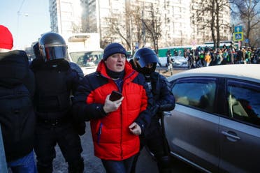 Law enforcement officers detain a man near a court building during a hearing to consider the case of Russian opposition leader Alexei Navalny, who is accused of flouting the terms of a suspended sentence for embezzlement, in Moscow, Russia February 2, 2021. (Reuters)