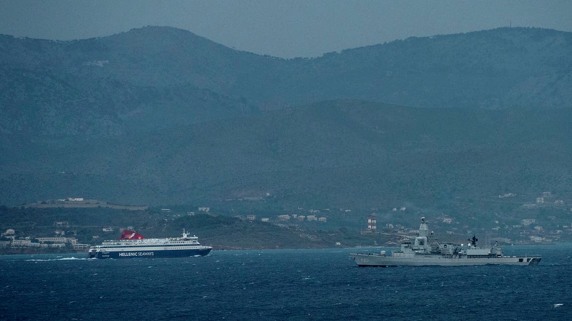 A picture taken on March 23, 2016 from Cesme district in Izmir, western Turkey, shows a Dutch NATO warship patrolling the Aegean Sea between the Turkish coast and the Greek Chios island on March 23, 2016. (AFP)