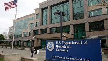 A man stands outside the US Department of Homeland Security (DHS) building and US Citizenship and Immigration Services (USCIS). (AFP)