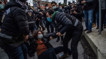 Turkish police detain a woman during a demonstration outside the Bogazici University in Istanbul, on February 1, 2021. (AFP)