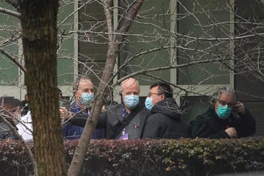 Peter Daszak of the World Health Organization team, center, chats after arriving at the Hubei Animal Disease Control and Prevention Center in Wuhan, China, Tuesday, Feb. 2, 2021. (AP)