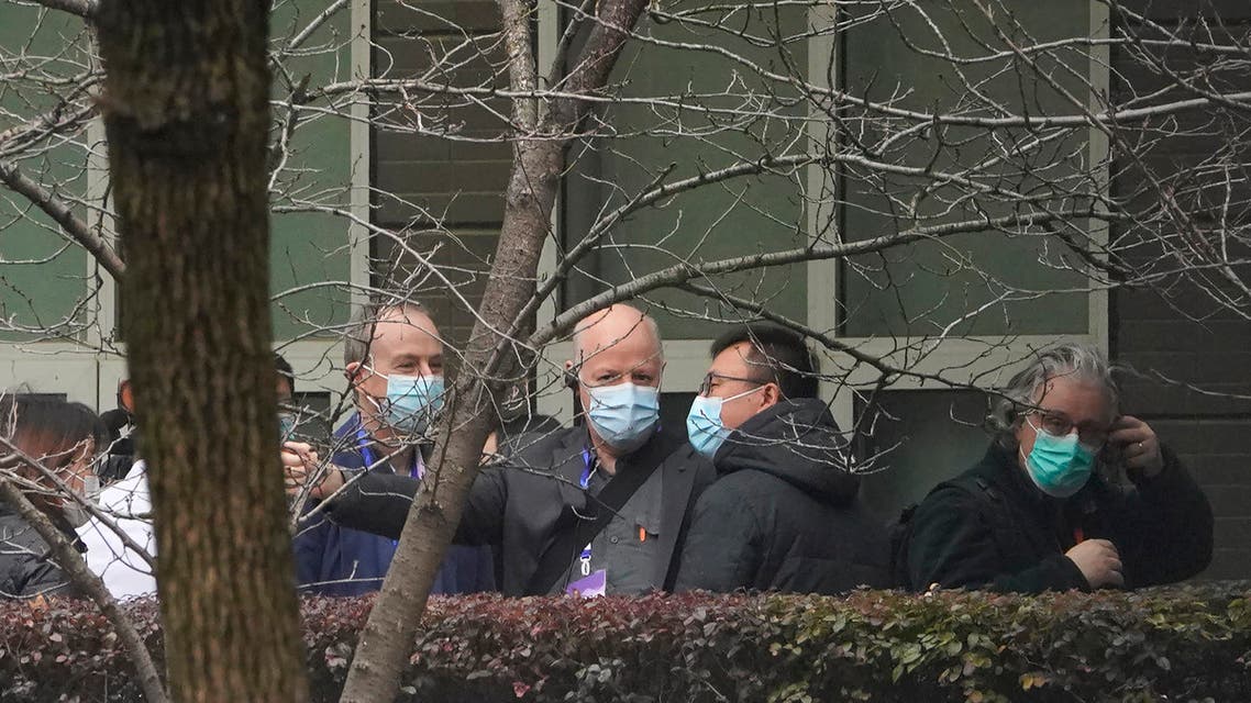 Peter Daszak of the World Health Organization team, center, chats after arriving at the Hubei Animal Disease Control and Prevention Center in Wuhan, China, Tuesday, Feb. 2, 2021. (AP)