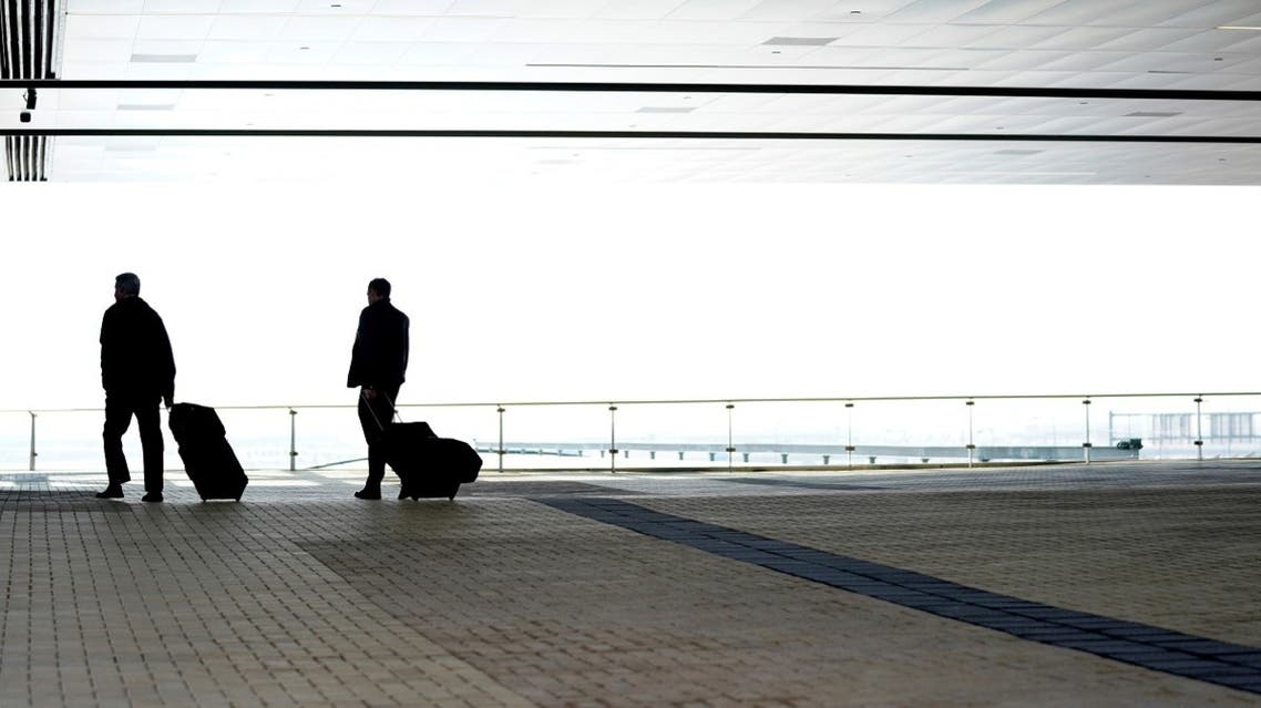 Business travelers enter the airport hotel at Denver International Airport in Denver, Colorado, US. (Reuters)
