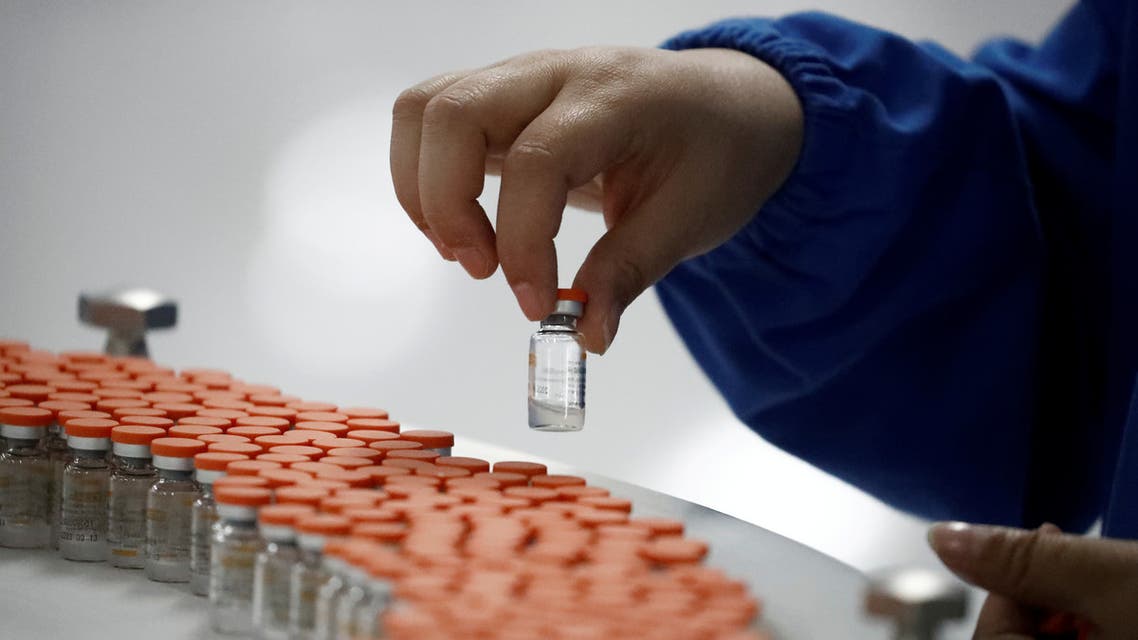  A worker performs a quality check in the packaging facility of Chinese vaccine maker Sinovac Biotech, developing an experimental coronavirus disease (COVID-19) vaccine. (Reuters)