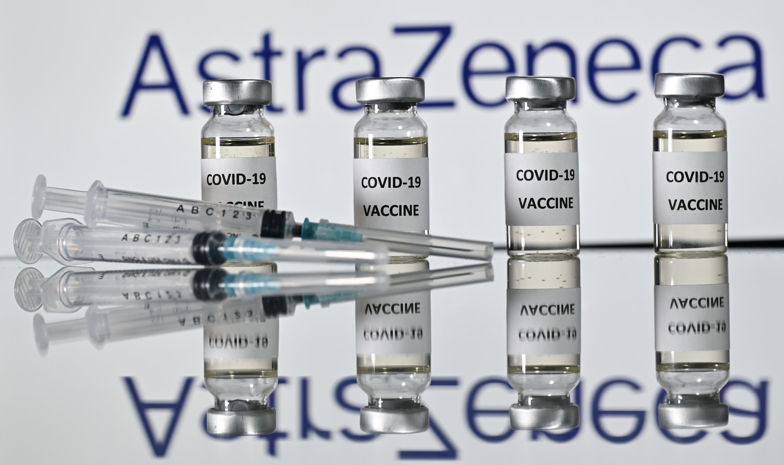 An illustration picture shows vials with Covid-19 Vaccine stickers attached and syringes with the logo of AstraZeneca. (File photo: AFP)