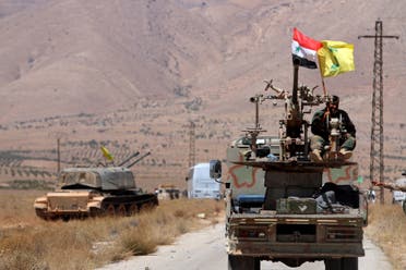 Hezbollah and Syrian flags flutter on a military vehicle in Western Qalamoun, Syria August 28, 2017. (File photo: Reuters)