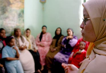 A counsellor talks to a group of women to try to convince them that they should not have FGM (Female Genital Mutilation) performed on their daughters in Minia, Egypt June 13, 2006. (Reuters)