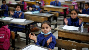 Refugee students gesture on the first day of the new school year at one of the UNRWA schools, in Amman, Jordan Sept. 1, 2020. (Reuters)
