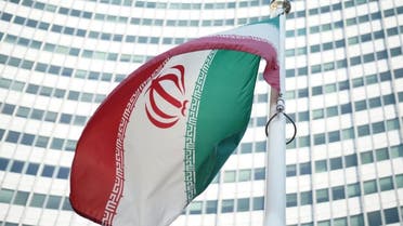 An Iranian flag waves in a wind outside the Vienna International Centre hosting the United Nations (UN) headquarters and the International Atomic Energy Agency (IAEA), on July 3, 2014. (AFP)