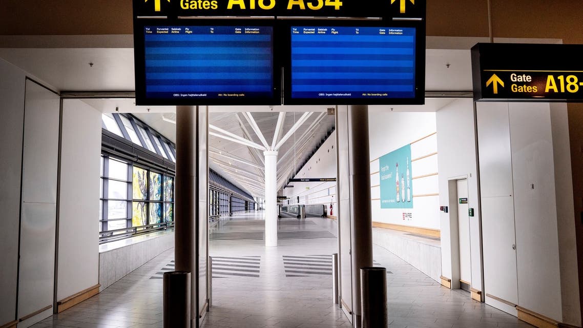 A picture taken on May 15, 2020 shows empty screens at almost empty Copenhagen Airport, amid the new coronavirus pandemic. (AFP)
