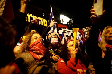 People protest against Israeli Prime Minister Benjamin Netanyahu’s alleged corruption while Israel is under a lockdown as part of the coronavirus restrictions in Jerusalem. (Reuters)