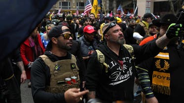 Proud Boys members Enrique Tarrio, left, and Joe Biggs march during a December 12, 2020 protest in Washington, D.C. (Reuters)