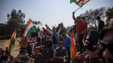 People shout slogans during a Maha Panchayat or grand village council meeting as part of a farmers’ protest against farm laws at Bhainswal in Shamli district in the northern state of Uttar Pradesh, India, on February 5, 2021. (Reuters)