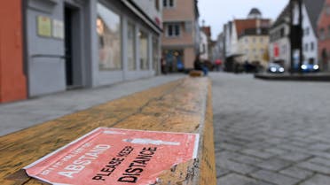 A distance sign is fixed at a bench in the city of Memmingen, southern Germany. (AFP)