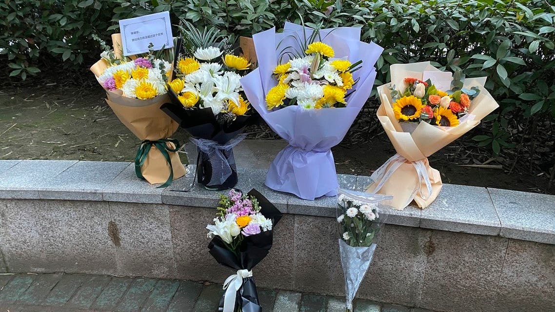 Floral tributes left outside Wuhan Central Hospital in memory of Dr. Li Wenliang, Feb. 7, 2021. (AP/Ng Han Guan)