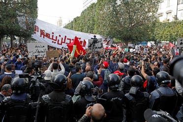 Demonstrators attend a protest to mark the anniversary of a prominent activist's death and against allegations of police abuse, in Tunis, Tunisia February 6, 2021. (Reuters/Zoubeir Souissi)
