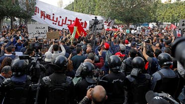 Demonstrators attend a protest to mark the anniversary of a prominent activist's death and against allegations of police abuse, in Tunis, Tunisia February 6, 2021. (Reuters/Zoubeir Souissi)