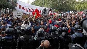 Police block large area of central Tunis as thousands protest over unmet demands